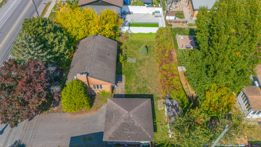 Aerial view of 2175 St. Laurent Blvd Ottawa showing an oversized lot with existing bungalow, large backyard, and surrounding residential homes, highlighting development and investment potential. Anna Alemi Real Estate