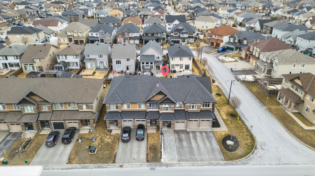 Front aerial view of a detached home for sale in Stittsville real estate at 399 Livery Street