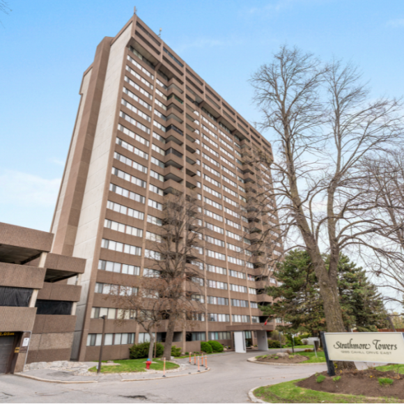 Anna Alemi Real Estate – 803 – 1285 Cahill Drive, Ottawa Exterior view of Strathmore Towers, a high-rise condominium featured in Ottawa real estate listings—offered by Anna Alemi as a spacious detached home alternative.